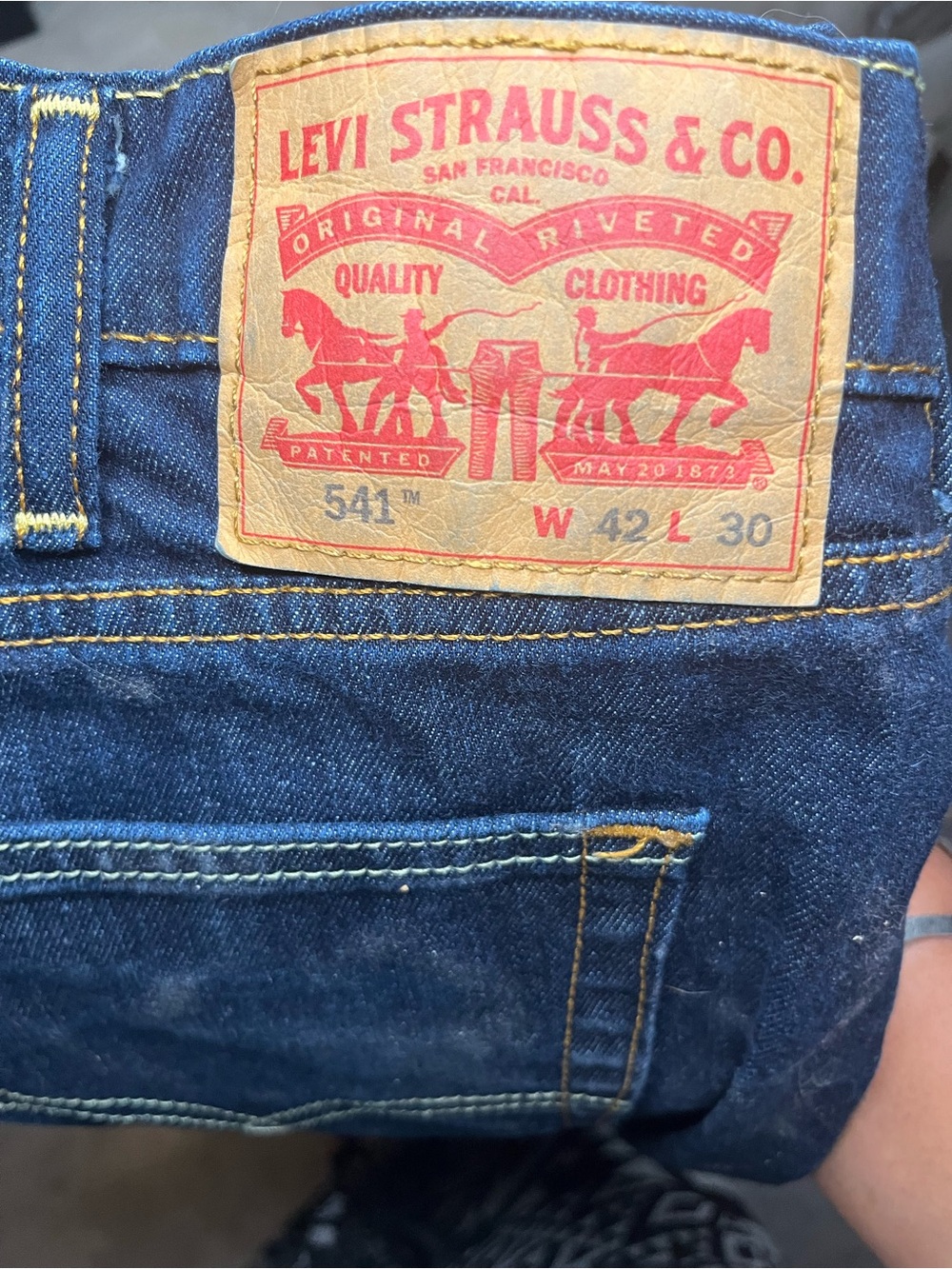 Levi's Men's Slim Jeans in Indigo Blue with Tan Patch